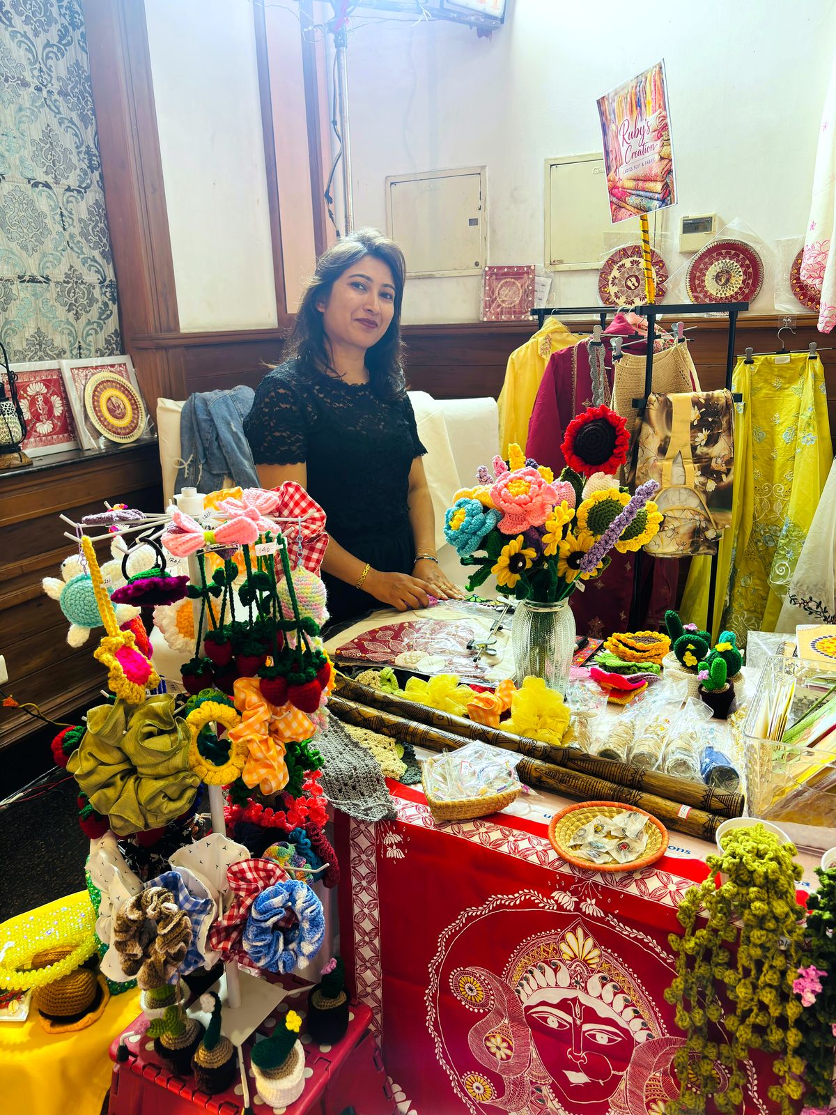 Uttarakhand Aipan artist at an exhibition with hand-painted works